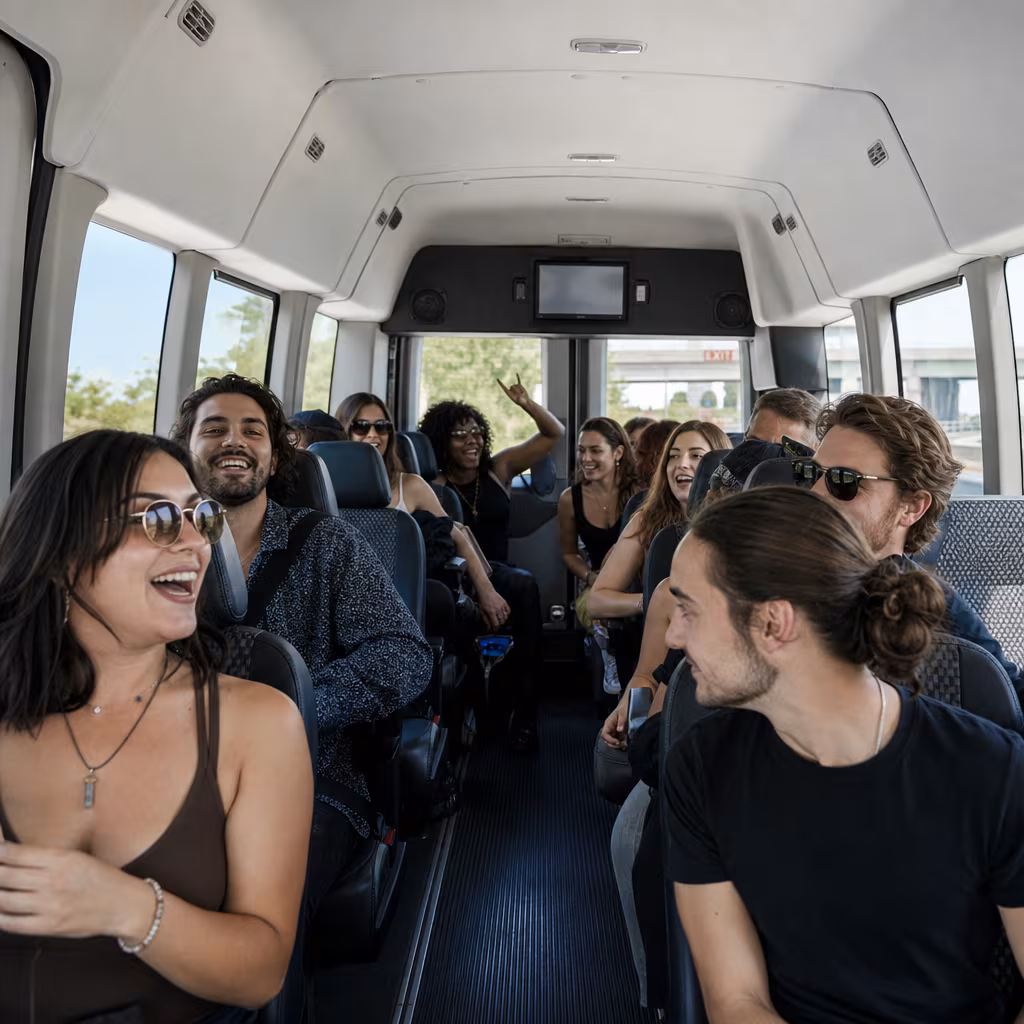 Party bus interior with wraparound leather seating and LED lighting in Baton Rouge
