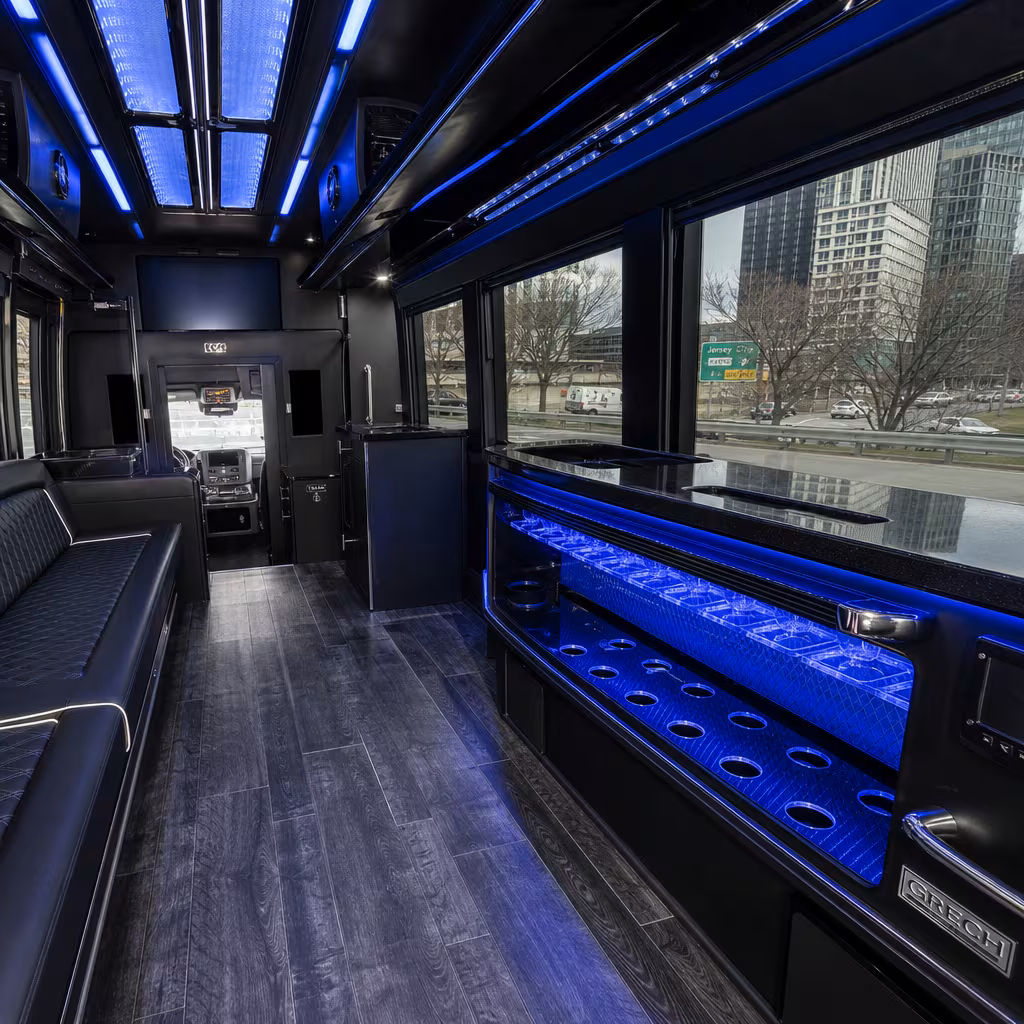 Party bus interior with wraparound leather seating and LED lighting in Baton Rouge