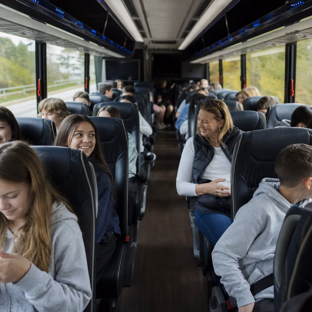Group boarding a white charter bus for School Transportation transportation in Baton Rouge