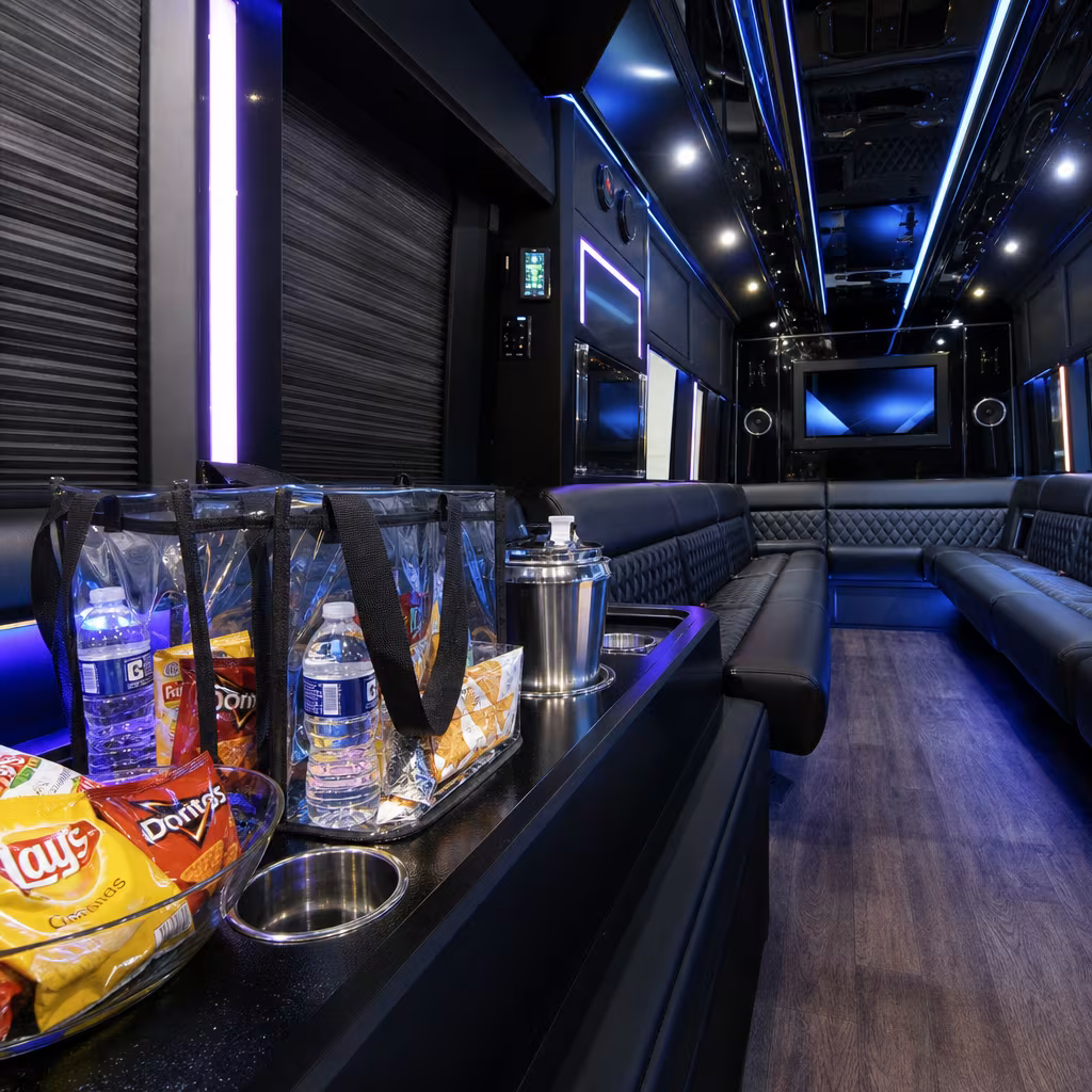 Party bus interior with wraparound leather seating and LED lighting in Baton Rouge